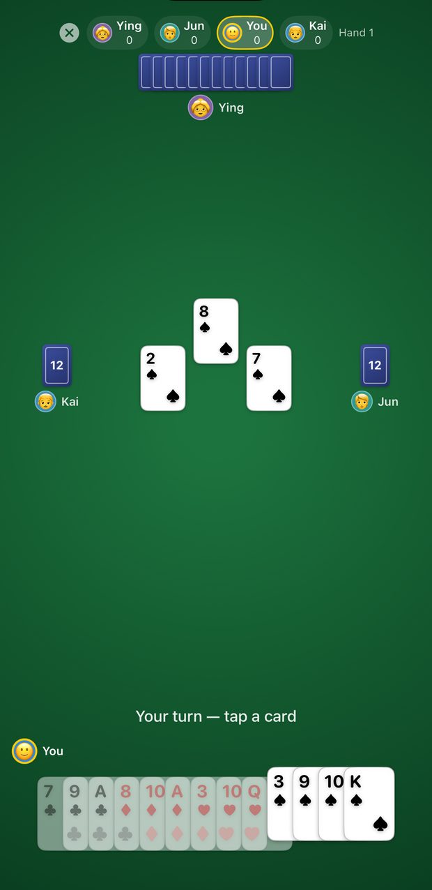 Mid-trick view: three spades played to the centre of the table, with the player's legal spade cards raised and bright and the rest of the hand dimmed.
